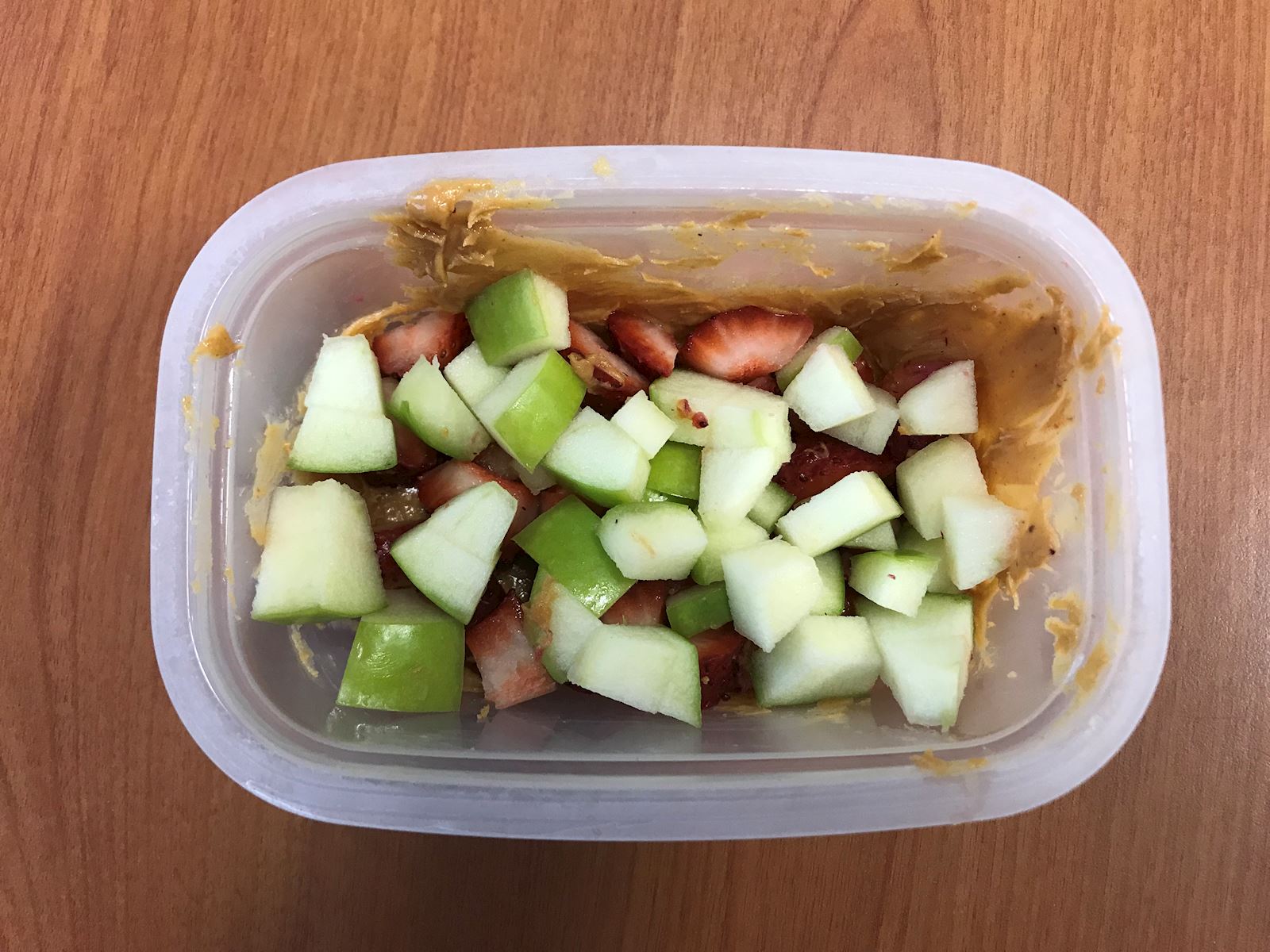 apples and strawberries on peanut butter